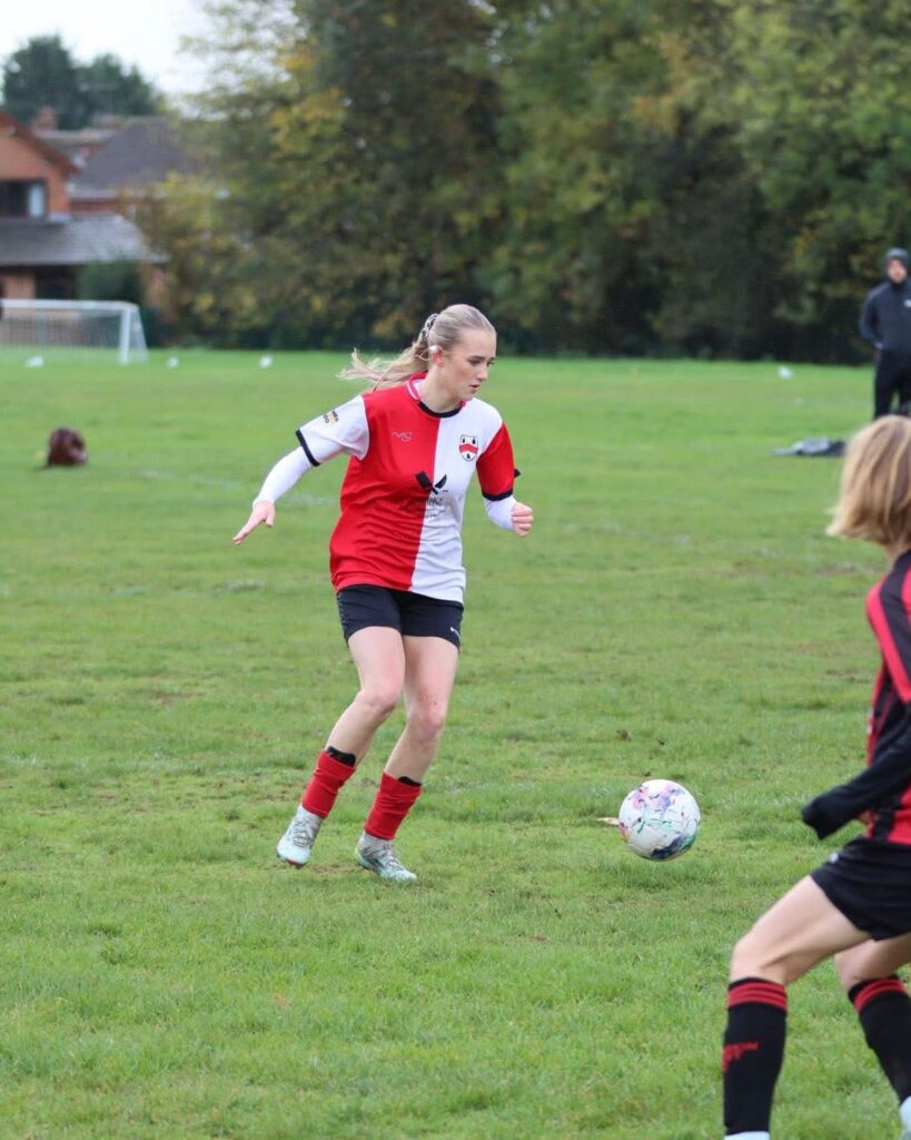 Old Wulfrunians player controlling the ball in their MG Sportswear custom football kit